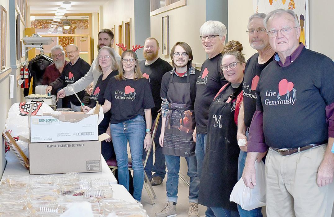 Members of the Ainsworth United Methodist Church had quite an assembly line for their 2022 Christmas Dinners. It all started with an empty plate and as the plate made its way down the line, it was filled with a traditional Christmas dinner.