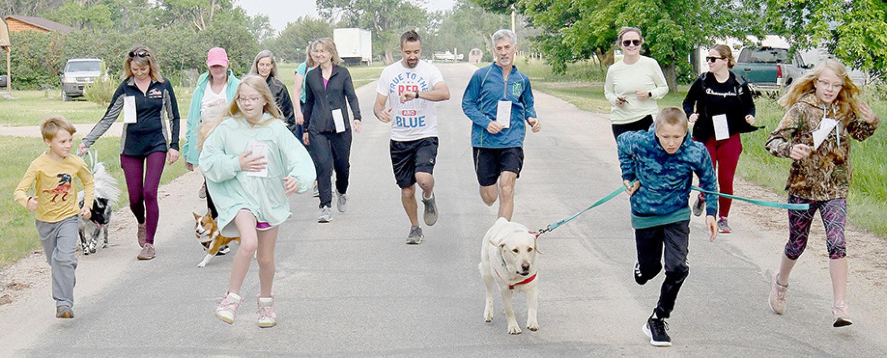 Walkers and runners were up bright and early for the 5K Hidden Paradise Walk/Run that started off the Lone Pine Outlaw Day at 7:30 a.m. First place winner in the 5K Run went to Michael Francavilla.