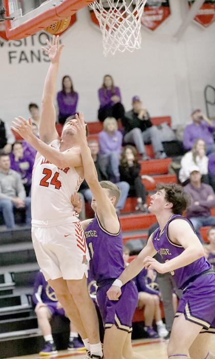 Trey Appelt powers up for two points against the Holdrege Dusters. Photo by Debb Gracey
