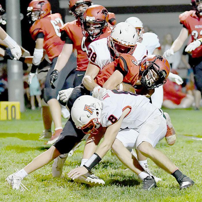 Trey Appelt and Traegan McNally combine on a tackle of Grady Drueke. Ainsworth’s defense held EPPJ to 217 yards offense and only eight points.