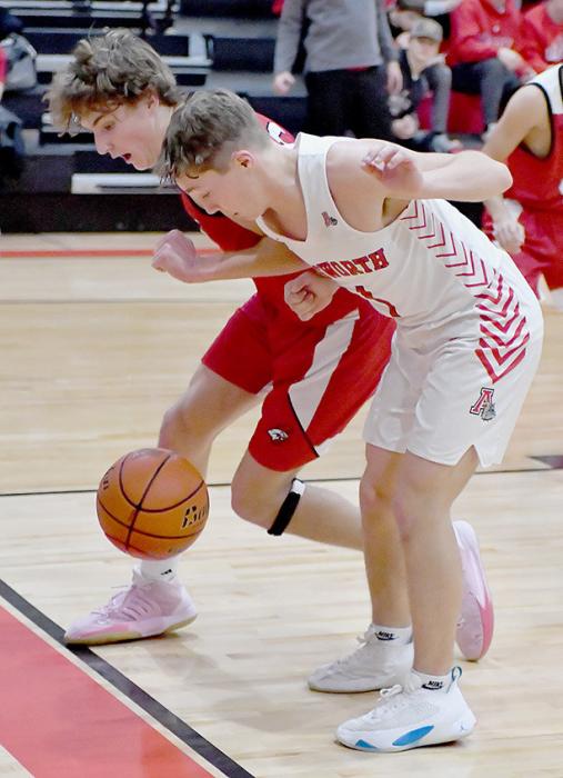 Morgan Kinney and an Ord player watch the ball as it goes out of bounds. Neither player wanted to be seen touching the ball and it dropped out of bounds.