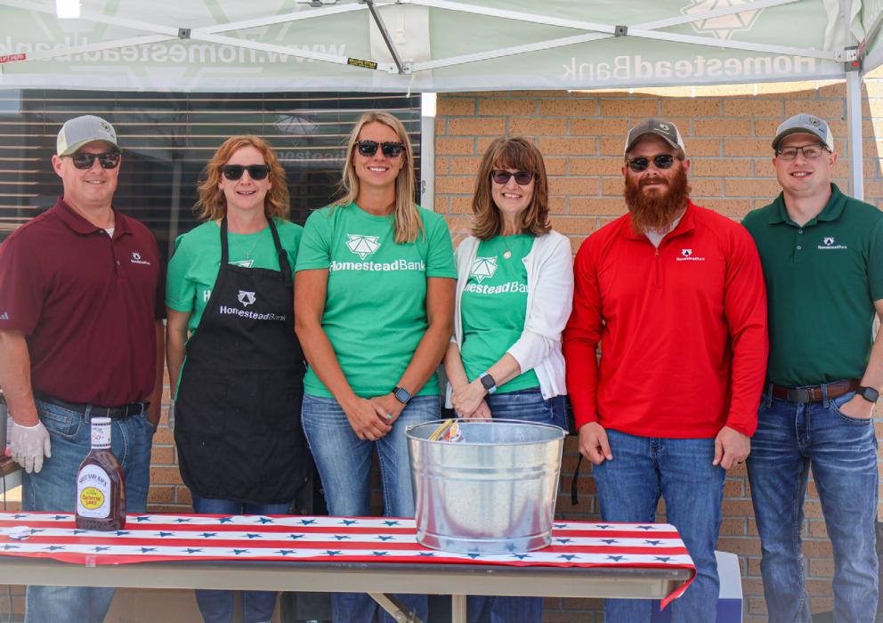 Staff members of the Ainsworth Homestead Bank served customers during an appreciation barbecue on Wednesday, June 24.