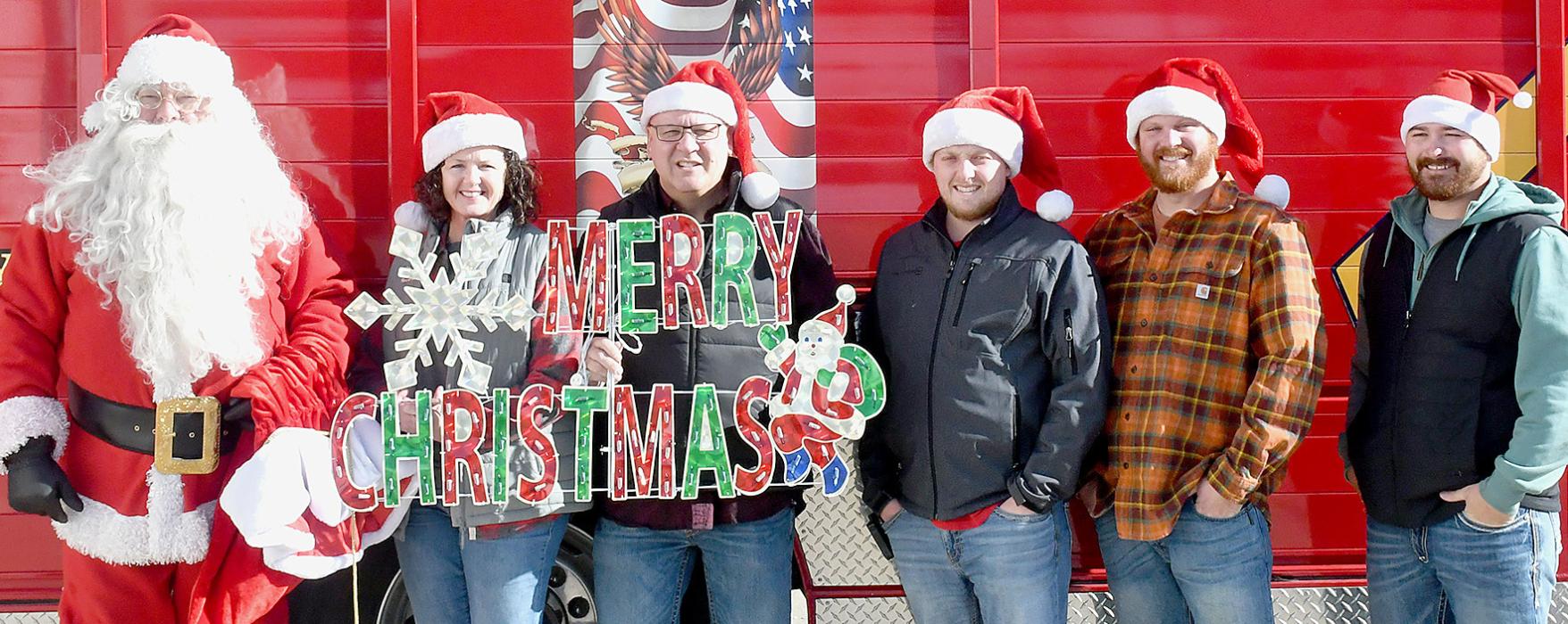 Santa Claus arrived in style, as the Ainsworth Fire Department gave him a ride to the event. Along with Santa are firemen Ann Fiala, Brad Fiala, Ben Wright, Drake Fiala and Ty Shelbourn.