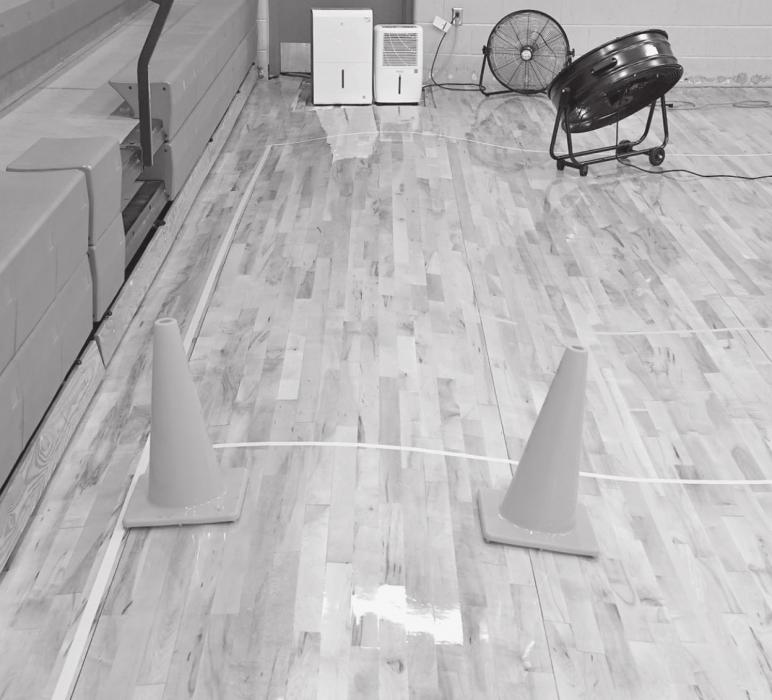 A water leak below the gym floor at the Ainsworth Community Center resulted in extensive warping that required partial floor replacement. It could not have come at a worse time – the ACS gym floor project was stuck at a standstill while the company waited for delayed flooring.