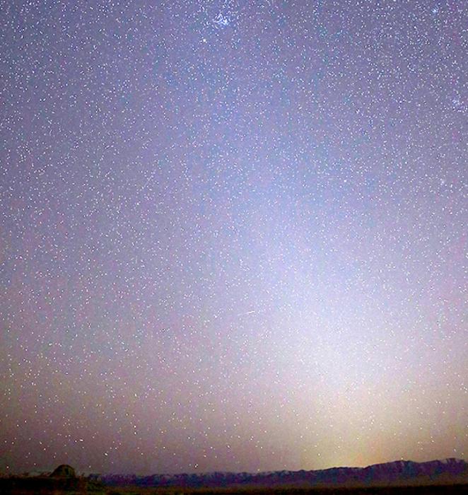 The zodiacal light extends into the Pleiades, as seen in the evening of March 1, 2021 above Skull Valley. Utah. The Pleiades star cluster (M45) is visible near the top. Credit and source:: NASA/Bill Dunford .https://www.flickr.com/photos/ gsfc/51030289967