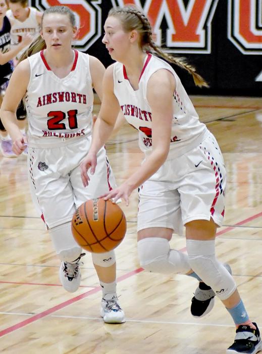 Bria Delimont brings the ball down the court. She had 14 points and 11 rebounds against Burwell.