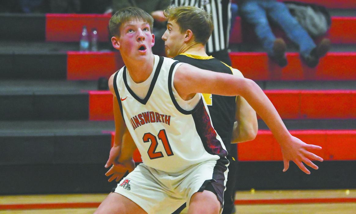 Jaxon Rucker boxes out a Bronco in order to grab a rebound. Rucker collected seven on the night.