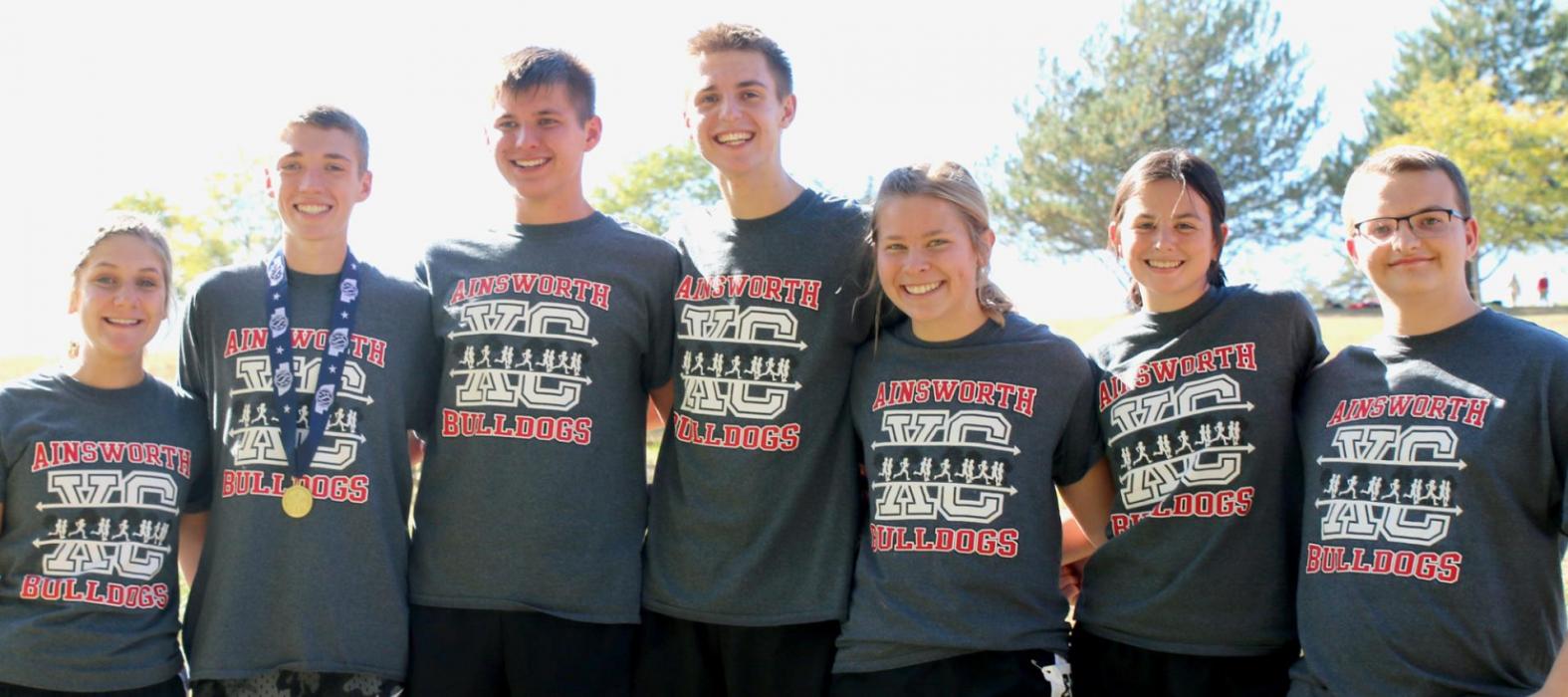 The Ainsworth Cross Country Teams say farewell to seven seniors, they are (left to right) Maren Arens, Ty Schlueter, Tommy Ortner, Ben Flynn, Alyssa Erthum, Kylie Higbee and Gavin Olinger.