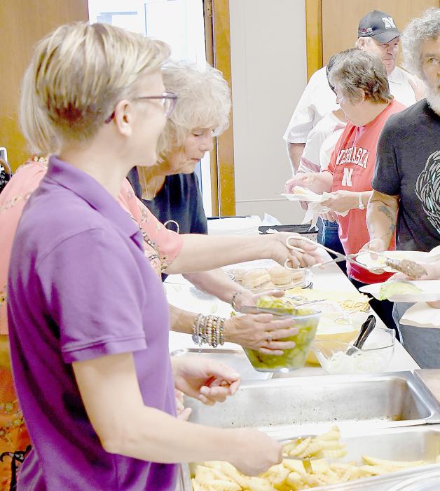 A great turnout supported the Ainsworth Does Drove #54 Hamburger Feed, Fries and Floats during the Friday Night Car and Motorcycle Show. As the Does served the food (Left) and Elk members (Right) grilled the hamburgers.