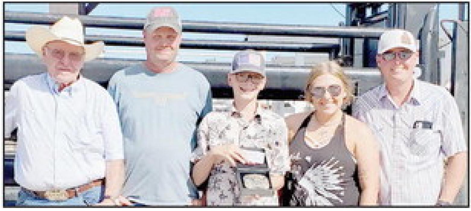 Presenting the Boys Memorial Buckle to the winner Jayse Daniels (center with the buckle) were Gene Buechle, Wade Buechle, Kelsey Buechle and Beau Buechle.