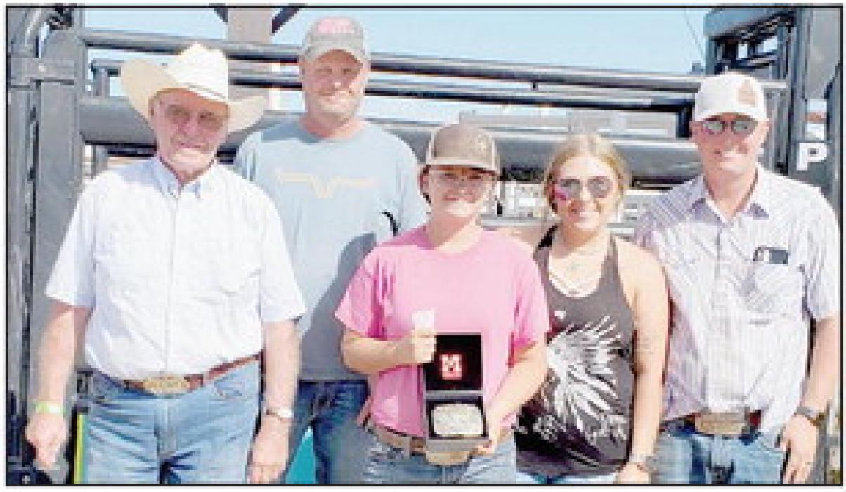 Presenting the Girls Memorial Buckle to the winner Madison Palmer (center with the buckle) were Gene Buechle, Wade Buechle, Kelsey Buechle and Beau Buechle.
