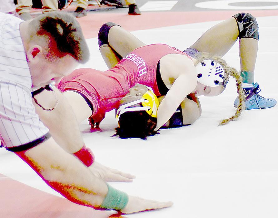 Jolyn Pozehl pinned Chelsey Robinson of Omaha North in 4:06. After winning her first match, Pozehl was defeated and had to work her way through the wrestle-backs.