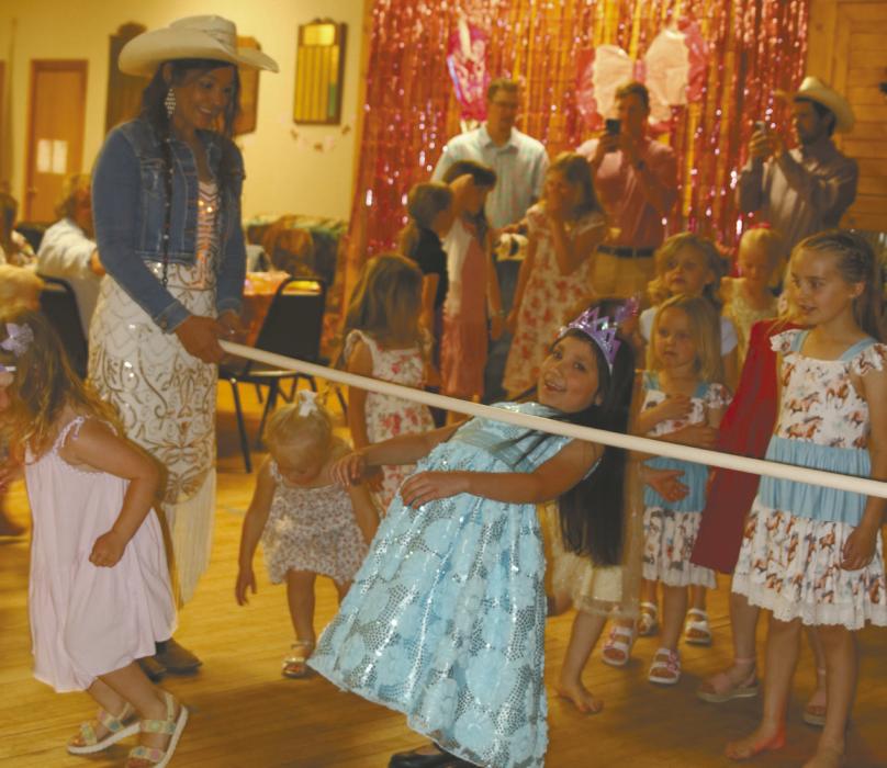 The Ainsworth Does Drove hosted its annual Daddy Daughter Dance on Saturday, May 2. Atendees above do the limbo during the dance.