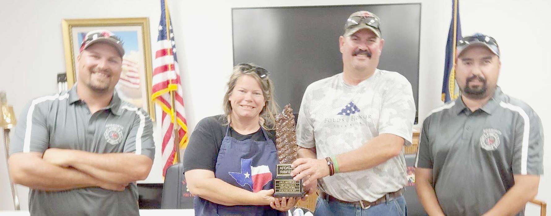 Winners of the 9th Annual Ribfest sponsored by the Ainsworth Fire Department were (Left to Right): Fireman Cameron Koch, Jenny DeNaeyer - 1st Place Pellet Grill, Ed Schukel - 1st Place Traditional and Fireman Heath Rudnick. All the ribs were donated by GJW, LLC - Greg Wilke.