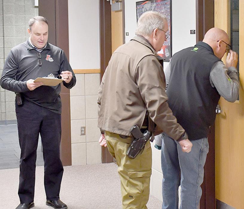 Brown County Sheriff Bruce Papstein and Brad Fiala covered the ground floor of the High School building with Superintendent Dale Hafer. They checked each door to ensure it was locked, knocked on the door to see if anyone would answer and looked through windows to see if anyone was visible.