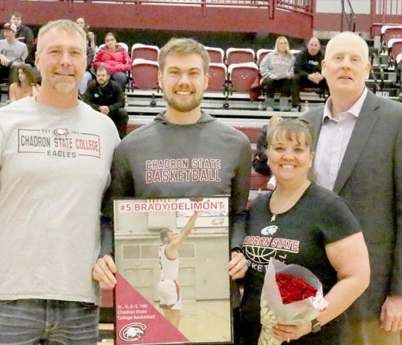 Brady Delimont, a 2016 AHS alum, was recognized at CSC Men’s Basketball Senior Recognition Night for his four years, 71 games and 459 points with the team. Pictured are (Left to Right): Brian, Brady and Laurie Delimont and Coach Shane Paben.