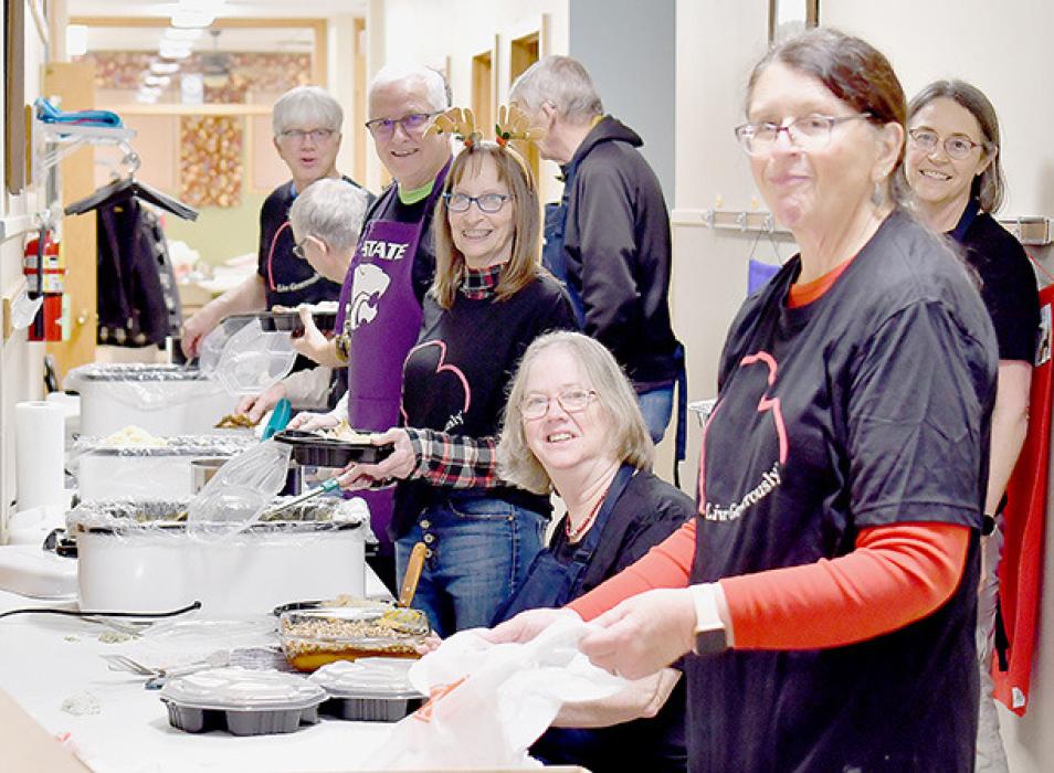 The volunteers had quite an assembly line filling up plates and getting the meals ready for pickup or delivery. They cooked eight turkeys and served 165 meals with all the trimmings.