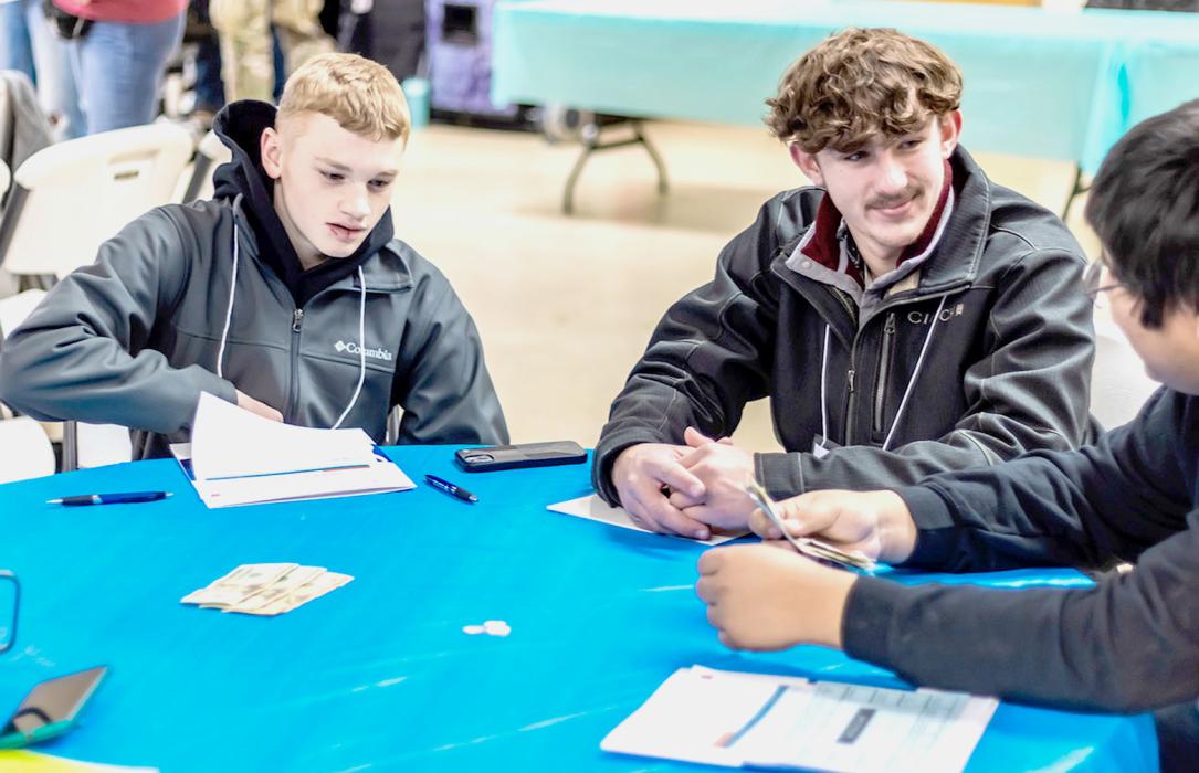 These Valentine students - with the money in the middle of the table - were learning the fine art of counting back change.