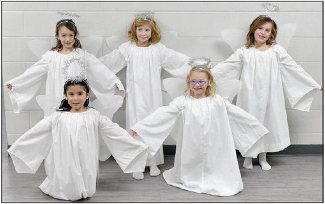 Six Little Angels perform during the 61st Annual Christmas Pageant. They sang “Away In The Manager” during the performance. This year’s angels were (Front Row - Left to Right): Brenda Carranza and Gracyn Peterson; and (Back Row - Left to Right): Cecilia Kerrigan, Brylee Barta and Sutton Buckles. Sick and unable to perform was Mindee King.