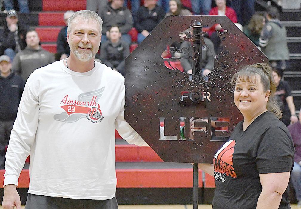 Delimonts Honored at Last Home Basketball Games