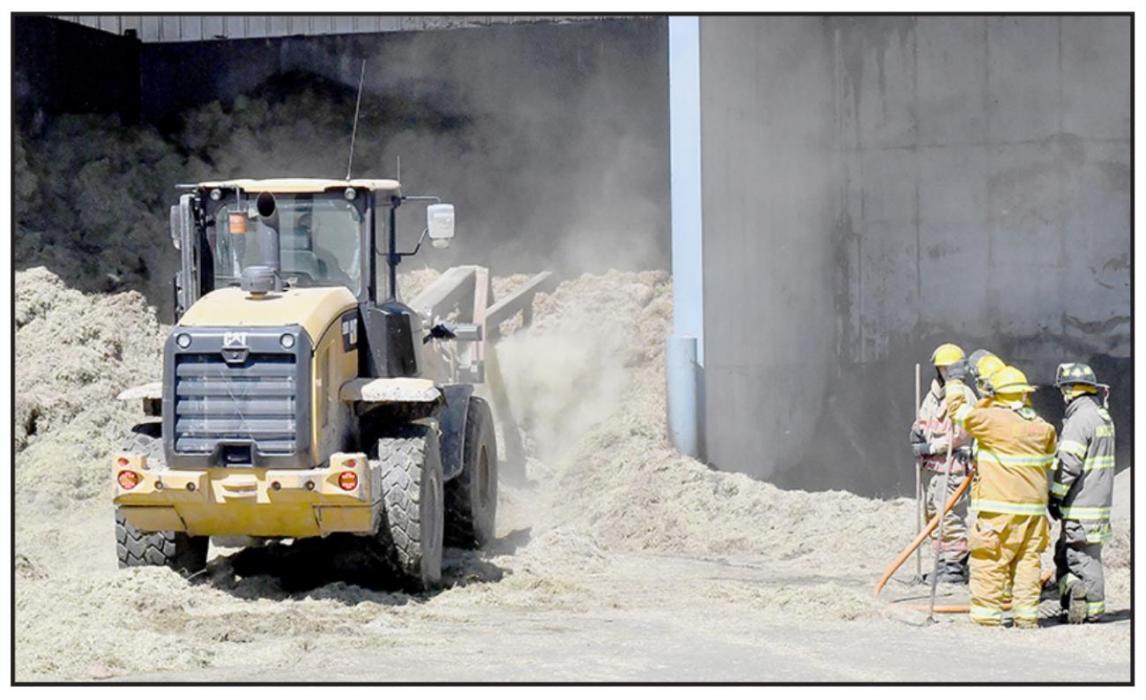 Firemen Respond to Hay Fire at Rolling Stone Feed Yard