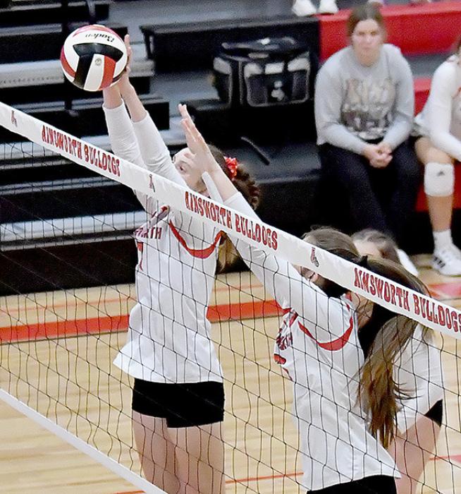 Good defense at the net helps win a volleyball game. Cameryn Goochey and Lauren Ortner are doing their part to make sure the ball goes back to the opponents side of the net.