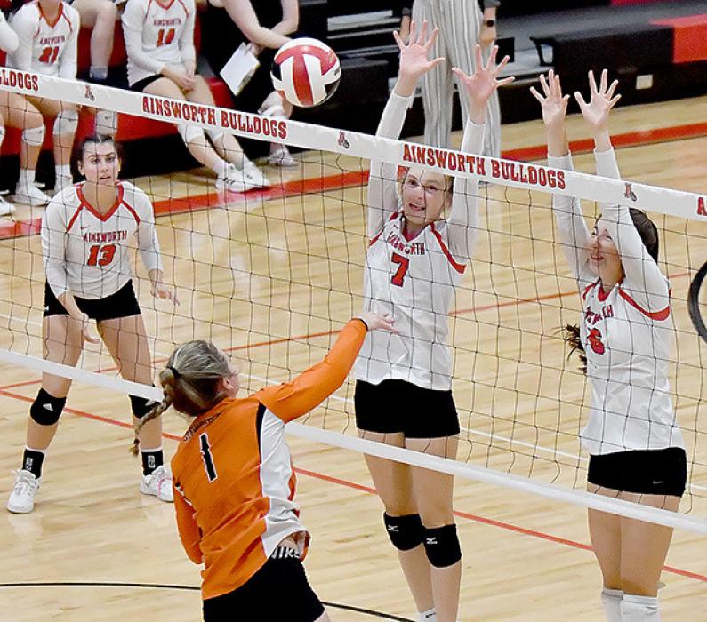 Defending the net against the Cody-Kilgore player Ally Heath (1) for Ainsworth was Cameryn Goochey (7) and Lauren Ortner (6). Bulldog player Dakota Stutzman (13) was ready to assist if needed.