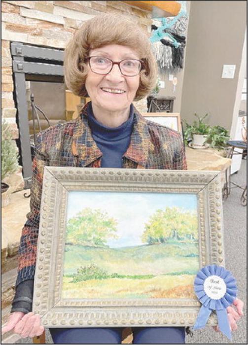 Cindy Bower with her Best of Show acrylic painting, “Nebraska Landscape”.