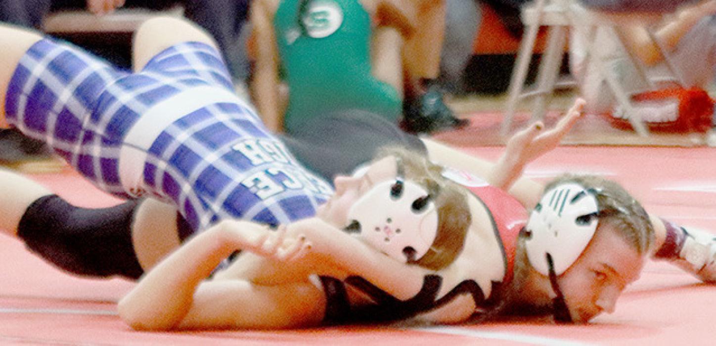 Jolyn Pozehl pinned Isabelle Streff of Pierce in 18 seconds to take first place in the 110 lb. weight class at Winside.