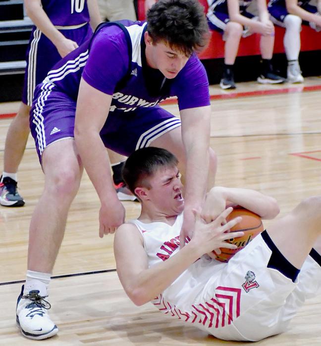 Trey Appelt fights for one of his 14 rebounds against Burwell. Appelt also had 12 points in the game.