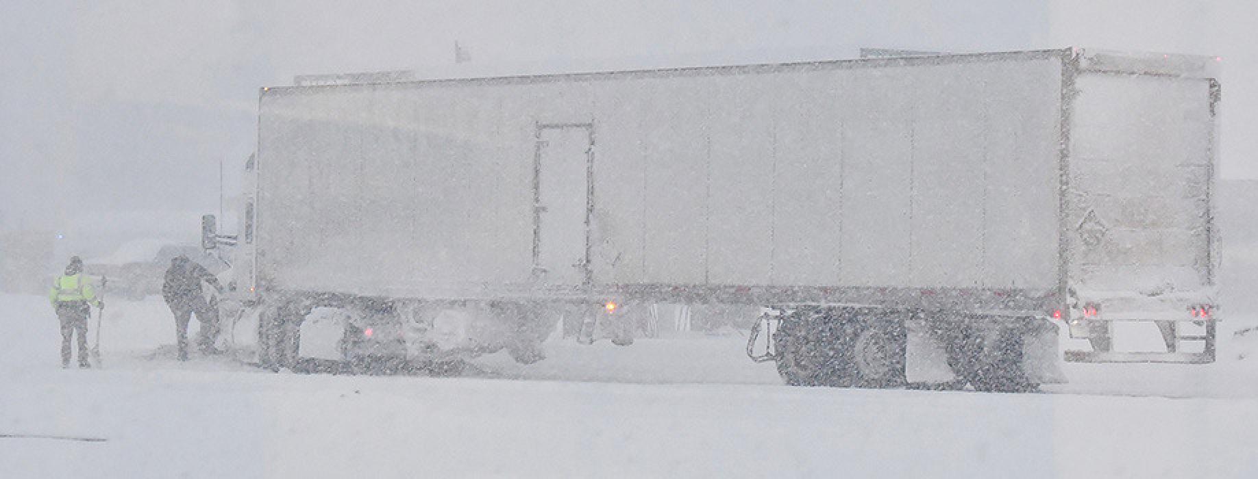 One of the first casualties of last week's snow storm was a truck driver on Monday afternoon, January 2nd. The driver was turning into Speedee Mart and due to limited visability caused by heavy snow, he drove into a pile of snow, getting stuck. Brown County Sheriff's Deputy B.J. Nilson attempted to help the driver scoop out his truck. A front-end loader was finally rounded up to push the truck out.