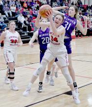 Cameryn Goochey pulls down a rebound against the Minden Lady Whippets. Goochey led the Lady Bulldogs in scoring with 13 points and had six rebounds.