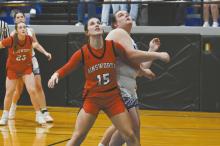 Junior Willa Flynn boxes out Karlene Kepler of North Central to gain position for a rebound.