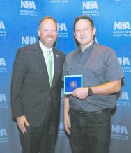 Michael Clay (right) is pictured receiving his award with NHA president Jeremy Nordquist, President and CEO of the NHA.