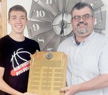 Ty Schlueter (left) was presented the 2021-22 KBRB Athlete of the Year plaque by Graig Kinzie (right), KBRB Radio owner.