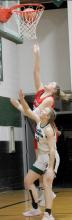 Karli Kral out-jumps a Sandhills/Thedford defender for two of her eight points on the night.