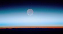 Earthshine as seen from the International Space Station with the sun just set - Astronaut Photograph ISS028-E-20073 was taken on July 31, 2011, and is provided by the ISS Crew Earth Observations Facility and the Earth Science and Remote Sensing Unit, Johnson Space Center.