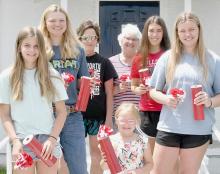 On Tuesday, June 7th, five members of the American Legion Unit #79 Junior Auxiliary distributed poppies to Ainsworth businesses in exchange for freewill donations, which amounted to $573.00. They were (front and center): Gracyn Peterson; (back row - left to right): Jaylee Good, Briley Naprstek, Amy Salzman, Shari Luther, Katherine Kerrigan and Jocelyn Good.