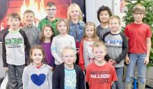 Second graders of Mrs. Beck share how they make their Christmas cookies. Her students include (Front Row - Left to Right): Iris Lentz, Kalli Kempcke and Landon Arens; (Middle Row - Left to Right): Dylan Johnson, Korra Mussman, Sofeah Magill, Sky Holloway and Toby Crooker; (Back Row - Left to Right): Carter Johnson, Easton Lammers, Ela Francis, Kameron Johnson and Lathan Palmer. Not pictured is Briggs Hladky.
