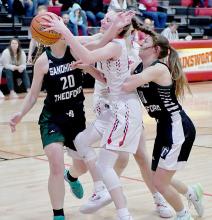 Cameryn Goochey got mugged by two Sandhills/Thedford players after she got a rebound.