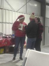 Kathy Worrell (left), a member of the Ainsworth Commercial Club, explains rules of the scavenger hunt to Ellie Conroy and her mother, Angie Welke. Participants picked up scavenger hunt cards from the Ainsworth Fire Department and were treated to hot cocoa, cider, and cookies before starting the scavenger hunt. The night originally called for fireworks, but with high wids, the firework display was cancelled. The winners of this year’s scavenger hunt were Kem Richstein and Cindy Buckles.
