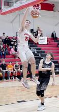 Carter Nelson picks up two of his 10 points against Chambers/Wheeler Central with a dunk.