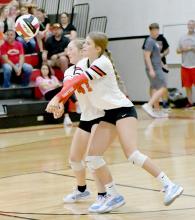 Bulldog teammates, Jaylee Good and Kinsey Walz, double up as they go after a serve. They helped to secure the victory against the North Central Lady Knights on their season opener for the 2024 season.