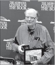 Ainsworth’s Robert Boss travelled to Lincoln to collect a plaque and certificate for winning an award with his book of poetry.