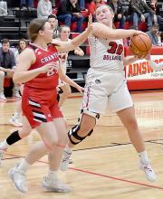 Jocelyn Good pulls down a rebound against the Ord Lady Chanticleers. Good had 13 points and seven rebounds against the Lady Chants.