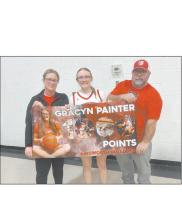 Ainsworth basketball junior Gracyn Painter reached a milestone of 1,000 points during the team’s game against Boyd County in the seventh-place matchup of the Niobrara Valley Conference Girls Basketball Tournament. She stands with her mother, Katie, and father, Clint.