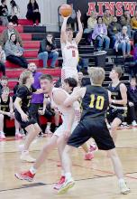 After a three game absent, Traegan McNally lit up the boards scoring 24 points for the Ainsworth Bulldogs. McNally made four of six 3-pointers and five of nine 2-pointers along with seven rebounds.