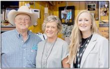 Joe McBride, Lori McBride and their daughter Rhe’Ann McBride (left to right). Rhe’Ann is the third generation of the family to work at Ranch-Land Western Store. “(My parents) wanted us to find our own passions … that we loved as much as my dad and my granddad loved the store,” she said. “It just so happened that I found that love, too.” Photo by Haley Miles for the Flatwater Free Press