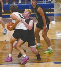 Witten Painter guards Jarek Erickson of Elgin Public/Pope John. Erickson was named the MVP of the game.