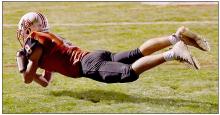 With just seconds left in the half, Traegan McNally made a diving catch in the end zone to get Ainsworth within two points of the North Central Knights. The PAT was good and the first half ended with both teams tied at 28 all.